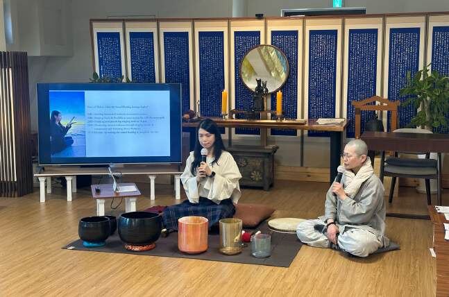 Helen with a monk at a temple in Korea