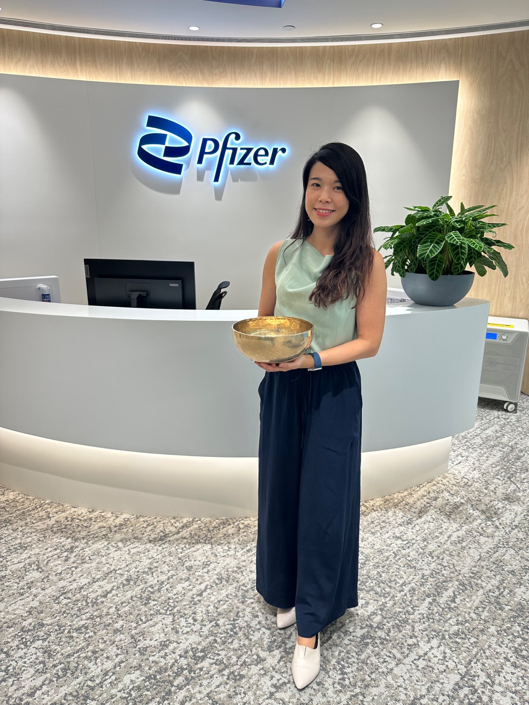Helen with a singing bowl at Pfizer Hong Kong