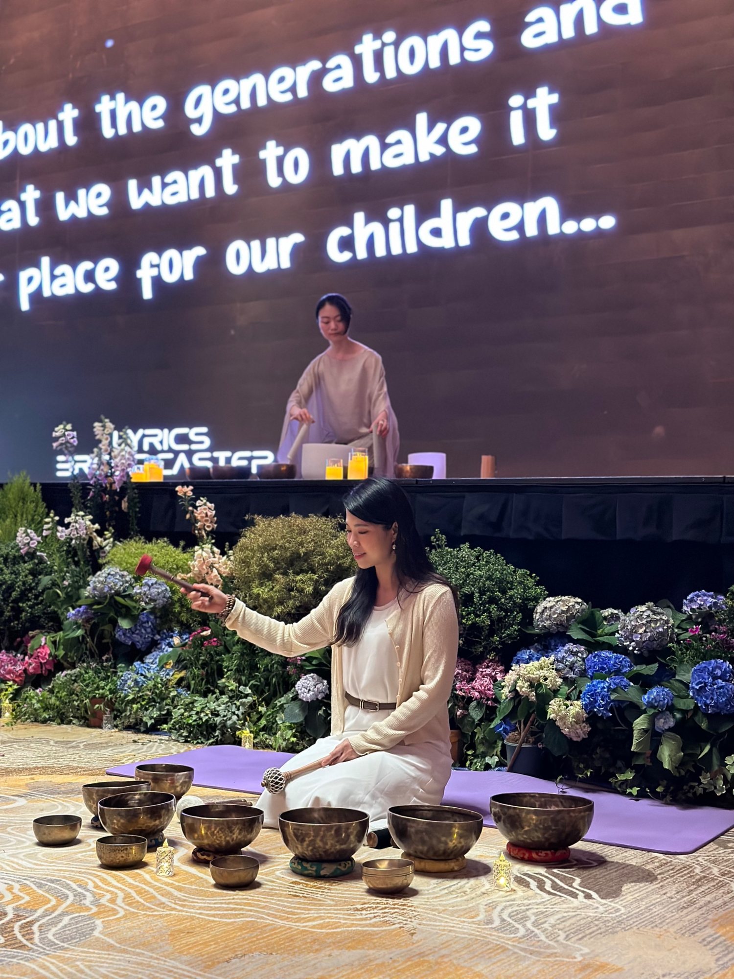 Helen playing singing bowls at the Healing Arts Festival